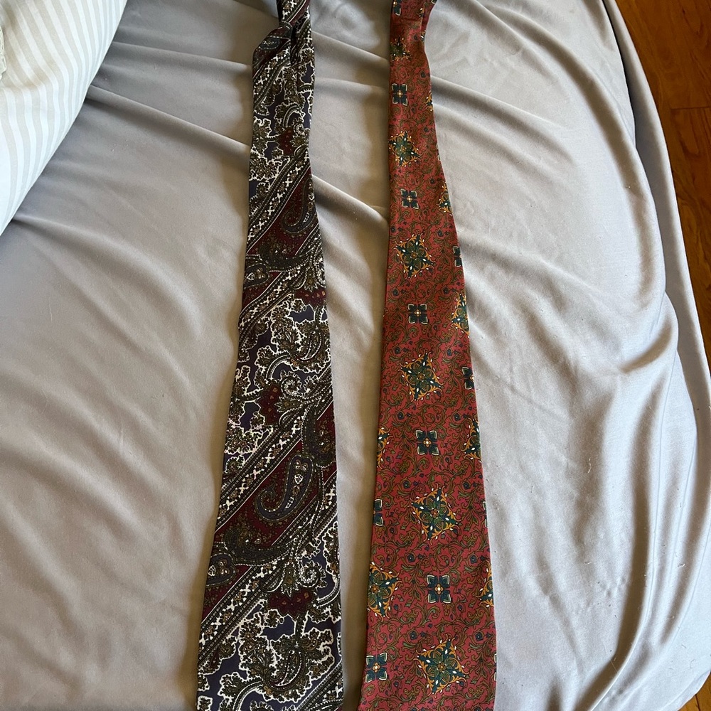 Modango tie, one is blue, the other is red burgundy with motifs
